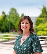 Leslie Leve standing outside